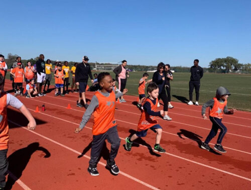 disabled chlldren running on a track
